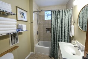 Combined shower/bathtub, hair dryer, towels, soap