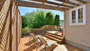Step out onto the covered deck and enjoy the serene surroundings.