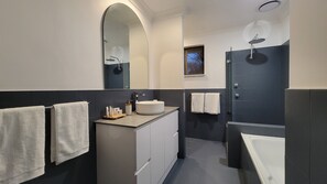 Bathtub, hair dryer, towels
