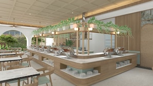 Un café moderne avec un comptoir central, un espace salon et des plantes.