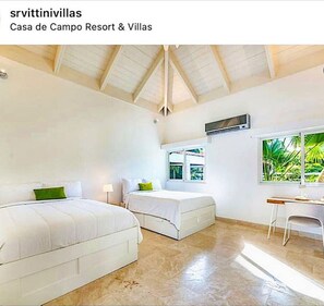 A bedroom with two beds, a desk, and a window with a view of greenery. - Snrvittinivillas Mng Spacius and Best Loc in Casa de Campo Resorts Gr8 Villa (La Romana)