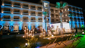 A hotel with multiple balconies and a well-lit facade. - Adamas Resort & Hotel (Shënkoll)