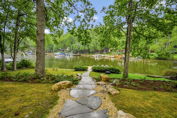 Take the newly hardscaped path down to the home's private dock and jump right in