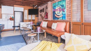 A cozy cafe with a brick wall, a wooden ceiling, and a seating area with a sofa and tables. - Vibin' Fun House 400meters (5 min walk) to D'Albora Marinas.
Outdoor Spa
 (Nelson Bay)