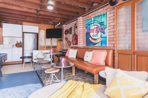 A cozy cafe with a brick wall, a wooden ceiling, and a seating area with a sofa and tables. - Vibin' Fun House 400meters (5 min walk) to D'Albora Marinas.
Outdoor Spa
 (Nelson Bay)