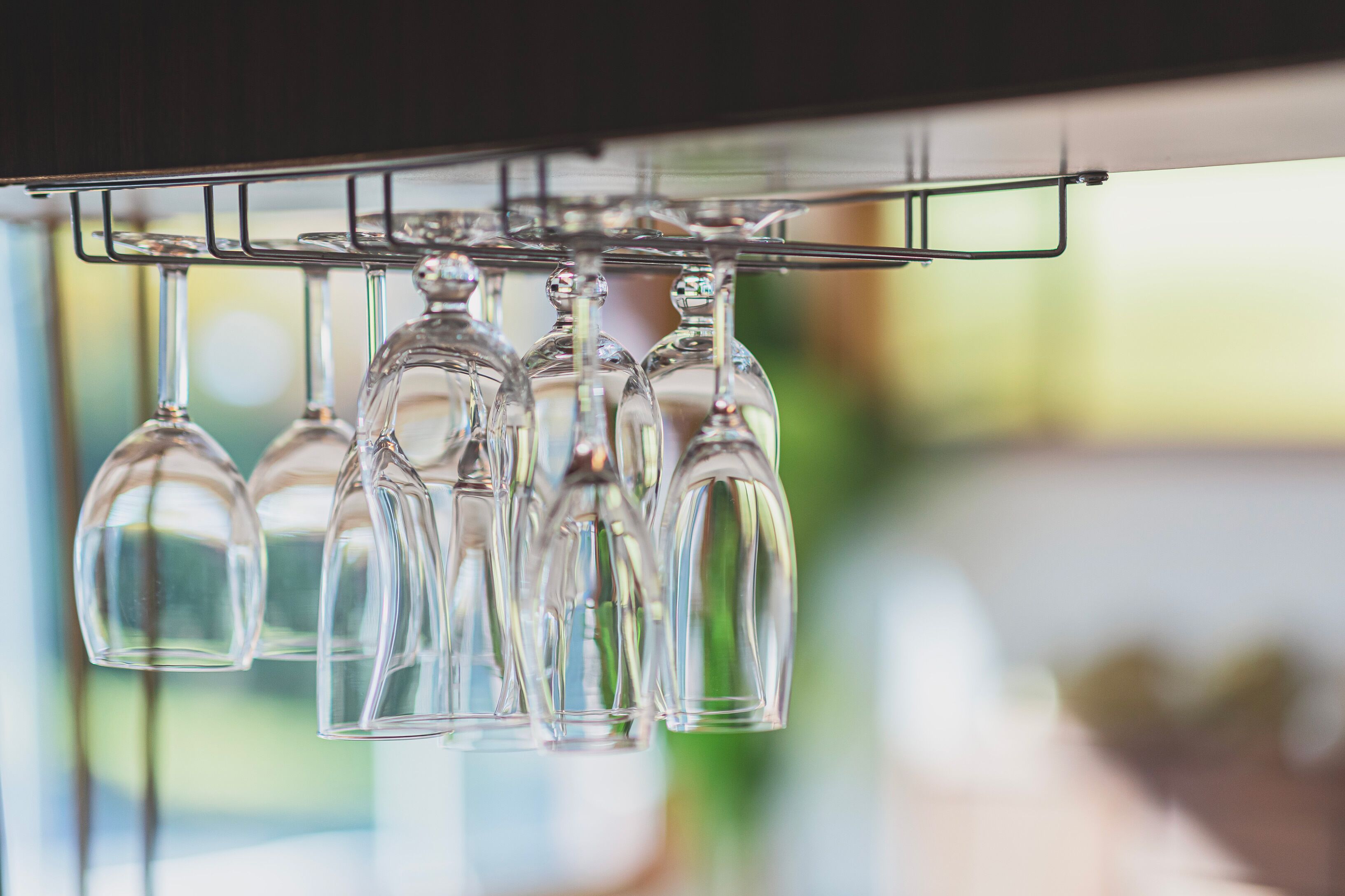 A rack holding several wine glasses.