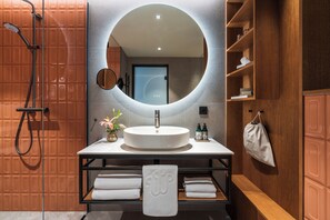 Signature Room (View) | Bathroom | Shower, rainfall showerhead, hair dryer, bathrobes