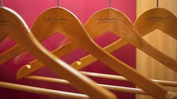 A row of wooden chairs with the name "Sabandia" engraved on the backrests, indicating a branded seating area.