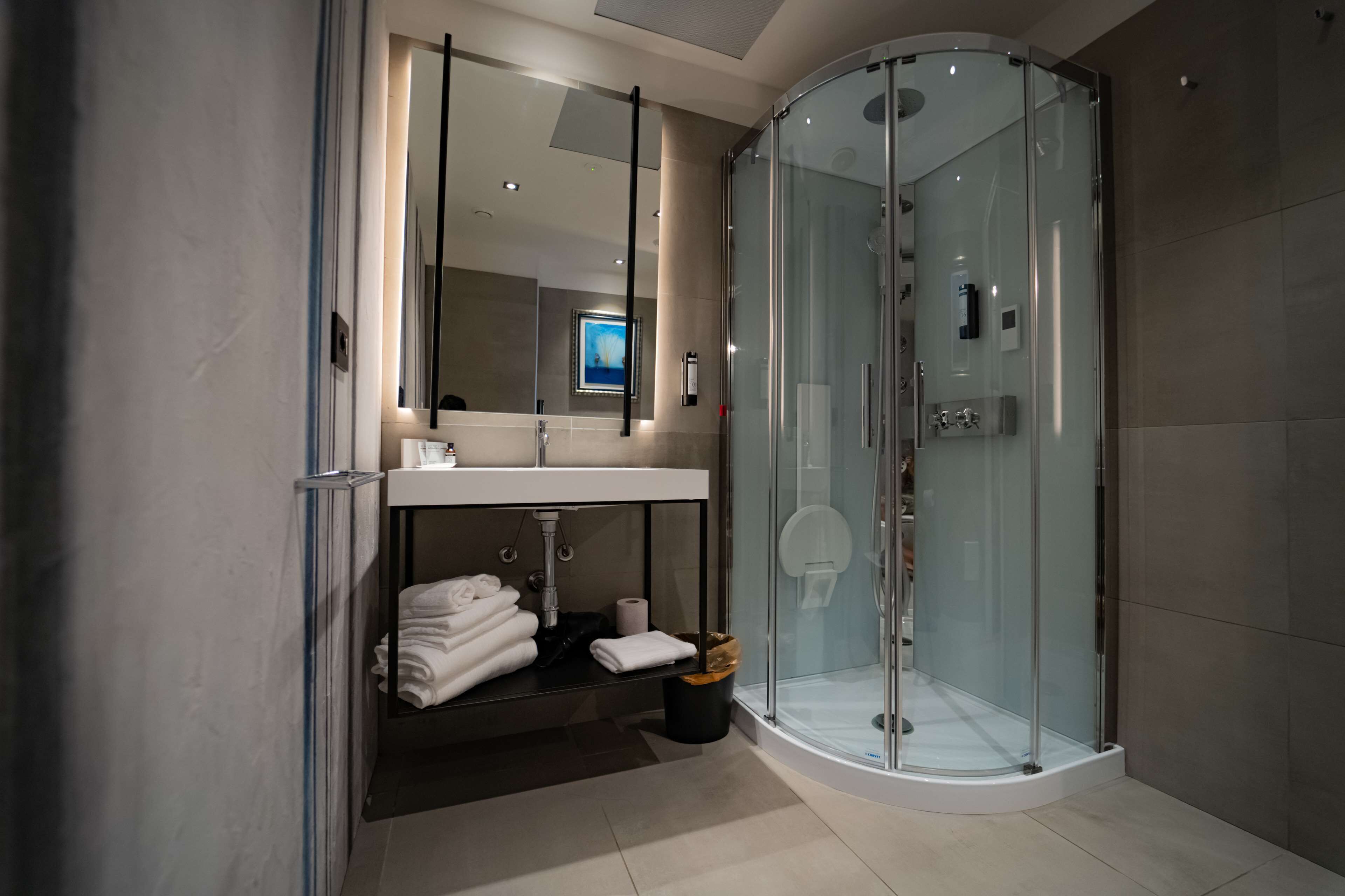 Shower, rainfall showerhead, designer toiletries, hair dryer