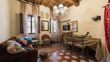 Apartamento conforto | Área de estar | TV de tela plana