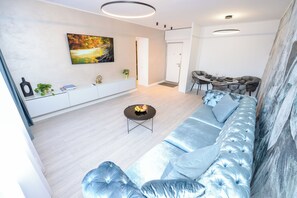 Apartment, 1 Bedroom, City View | Living area | Books