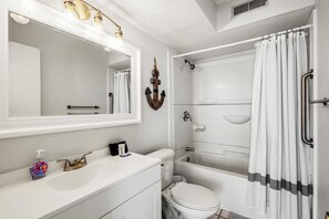 Bathtub, hair dryer, towels