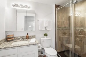 Shower, hair dryer, towels, soap