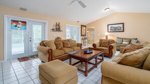 House, 3 Bedrooms | Living area - 14933 Bonaire Circle - Sunset Special by Coastal Vacation Properties (Fort Myers)