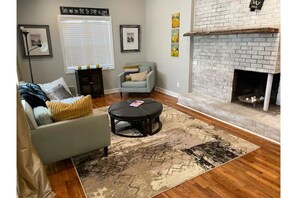 Smart TV, fireplace, books, stereo