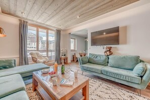 Relax in this stylish living room with a city view, flat-screen TV, and comfortable seating area.