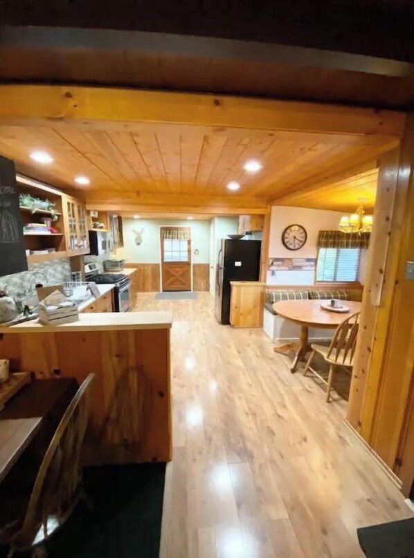 Enjoy cooking and dining in this spacious kitchen with a central island and dining area.