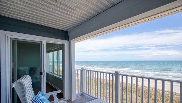 A covered balcony with a view of the ocean. - Sea Oats D-3, 3BD 2BA Oceanfront Paradise (North Myrtle Beach)
