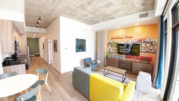 Exclusive Apartment | Living area | 55-inch Smart TV with digital channels, TV, iPod dock
