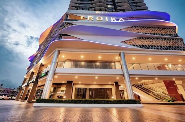 Experience the unique architecture of TROIKA, featuring a dynamic blend of curves and angles.