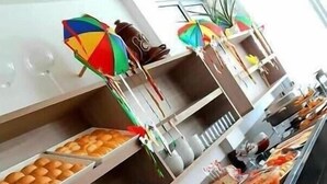 A buffet setup with various food items and beverages.