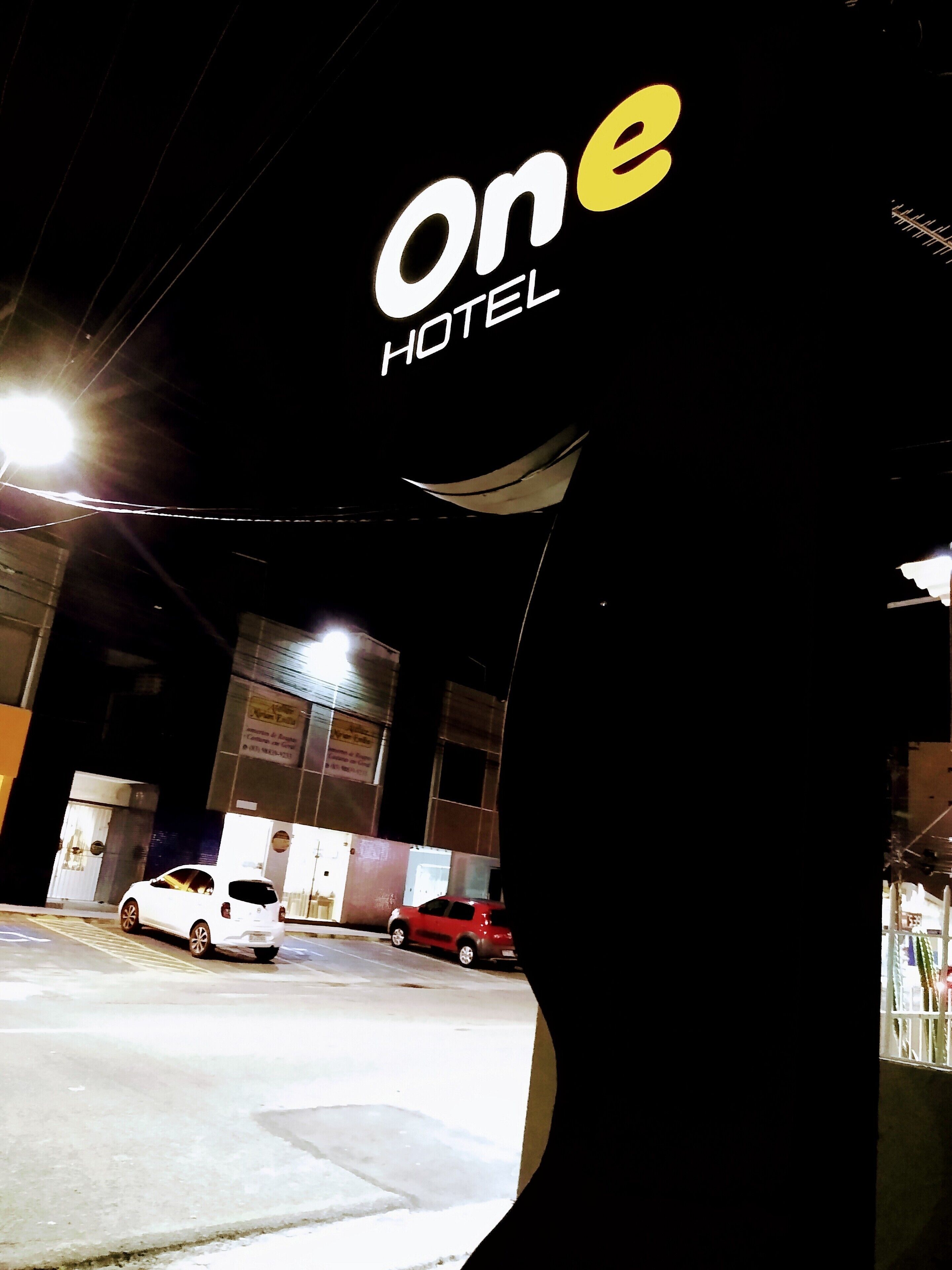 A hotel sign with the name 'one HOTEL'.