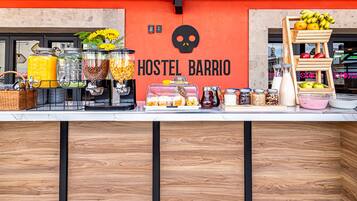 A breakfast bar with various food items and condiments.