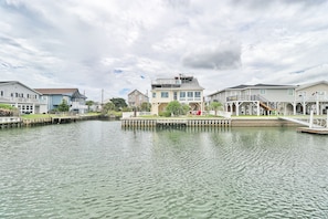 Waterfront homes with attached docks and scenic views of the surrounding greenery.