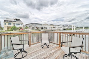 Guests can enjoy a serene view of the marina from the deck.