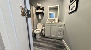 Combined shower/bathtub, hair dryer, towels, soap