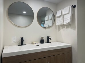 Combined shower/tub, hair dryer, towels, soap