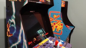 A Midway Mortal Kombat arcade machine with a colorful design and multiple joystick controls. - Poconos Top Rated Resort - Saw Creek Estates (Bushkill)