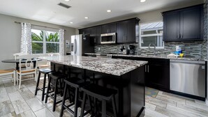 House, 4 Bedrooms | Private kitchen - 231 Ostego Shells N Sunshine by Coastal Vacation Properties (Fort Myers Beach)