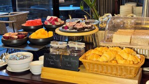 A buffet with various food items, including fruits, pastries, and jams. - Passa Hotel Bangkok (Bangkok)