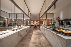 A modern kitchen with marble countertops, pendant lighting, and a central island. - Grand New Century Hotel, Wenzhou, A Tribute Portfolio Hotel (Wenzhou)