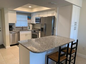Condo, 2 Bedrooms | Private kitchen - Estero Cove # 523 - 6895 Estero Blvd by Coastal Vacation Properties (Fort Myers Beach)