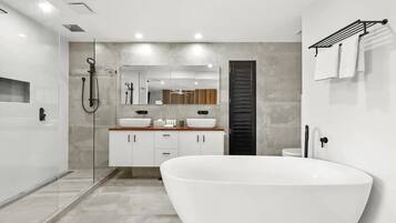 Combined shower/bathtub, hair dryer, towels, soap