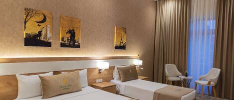 Premium bedding, down comforters, minibar, desk