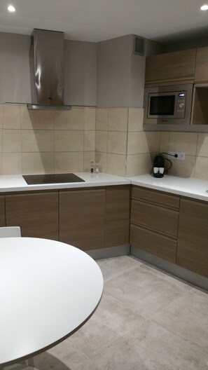 Fridge, microwave, stovetop, coffee/tea maker