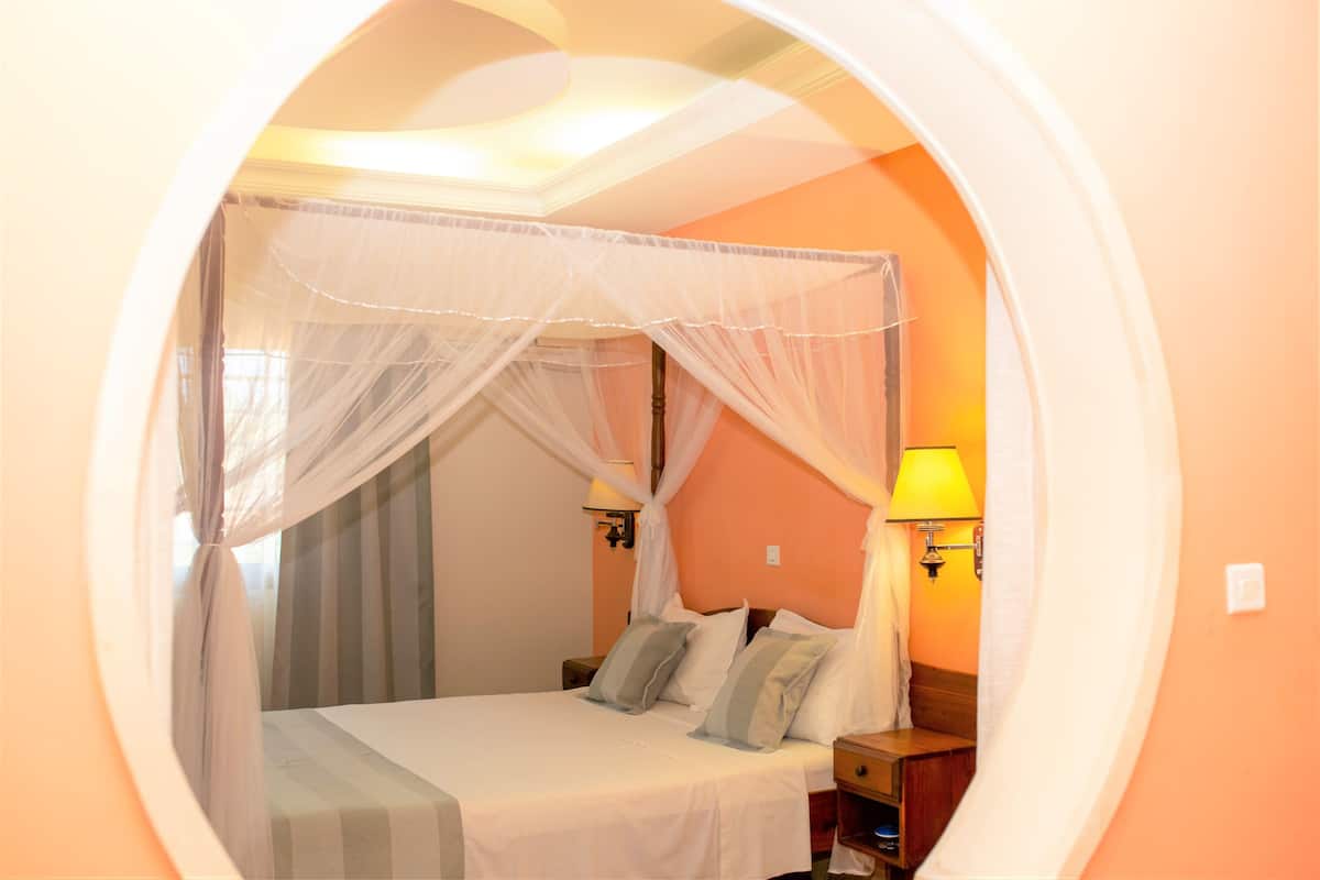 Classic Suite, Garden View | 1 bedroom, in-room safe, iron/ironing board, free WiFi