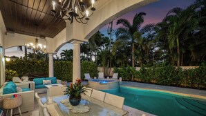 An outdoor pool area with lounge seating, a hot tub, and a covered patio with a view of palm trees. - BY THE SEA VACATION VILLAS 5 STAR AQUABELLA  5/4 PRIVATE POOL WALK TO BEACH (Fort Lauderdale)