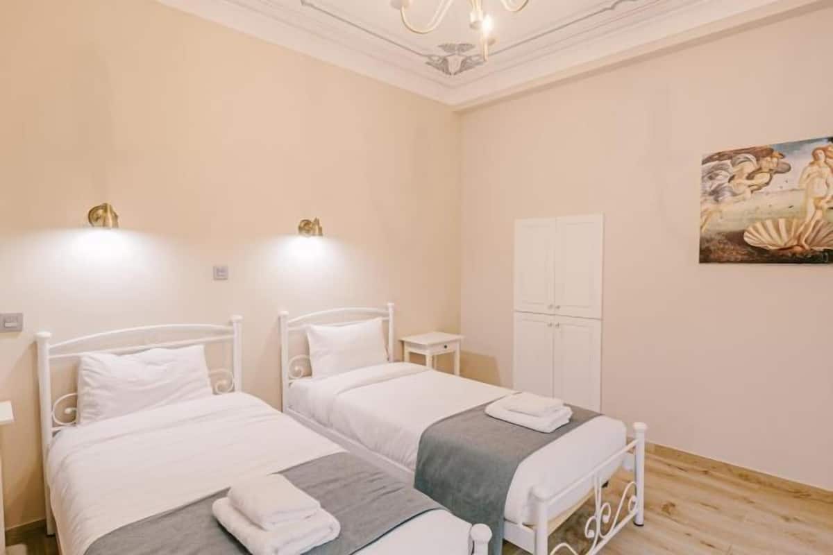 Memory-foam beds, minibar, desk, laptop workspace