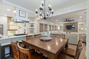 - Overlooks the bright, stylish living room, making it perfect for entertaining or conversation - Sleek white island offers extra counter space & bar seating for casual dining - Blend of coastal charm & modern touches sets a relaxed, elevated tone - Coastal home w/ bikes & fenced yard (Santa Rosa Beach)