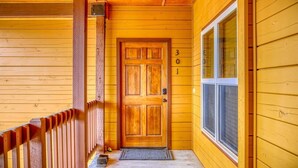 A wooden exterior with a door marked '3' and a window. - Cozy Golf course condo with A/C (pagosa springs)
