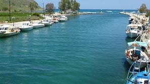 A marina with several boats docked along the shore. - Villa Artemis in Vrises (Apokoronas)