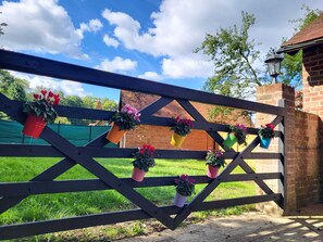 Stroll through the beautifully manicured lawn to a charming brick building with a traditional charm.