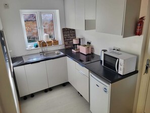 Enjoy cooking in this well-equipped kitchen with a microwave and toaster.