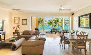 Signature Condo | Living area | 43-inch flat-screen TV with cable channels, TV - Villa Renaissance Grace Bay (Providenciales)