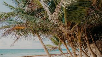 Private beach, white sand, sun loungers, beach towels