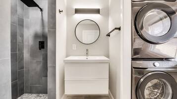 Bathtub, hair dryer, towels, soap